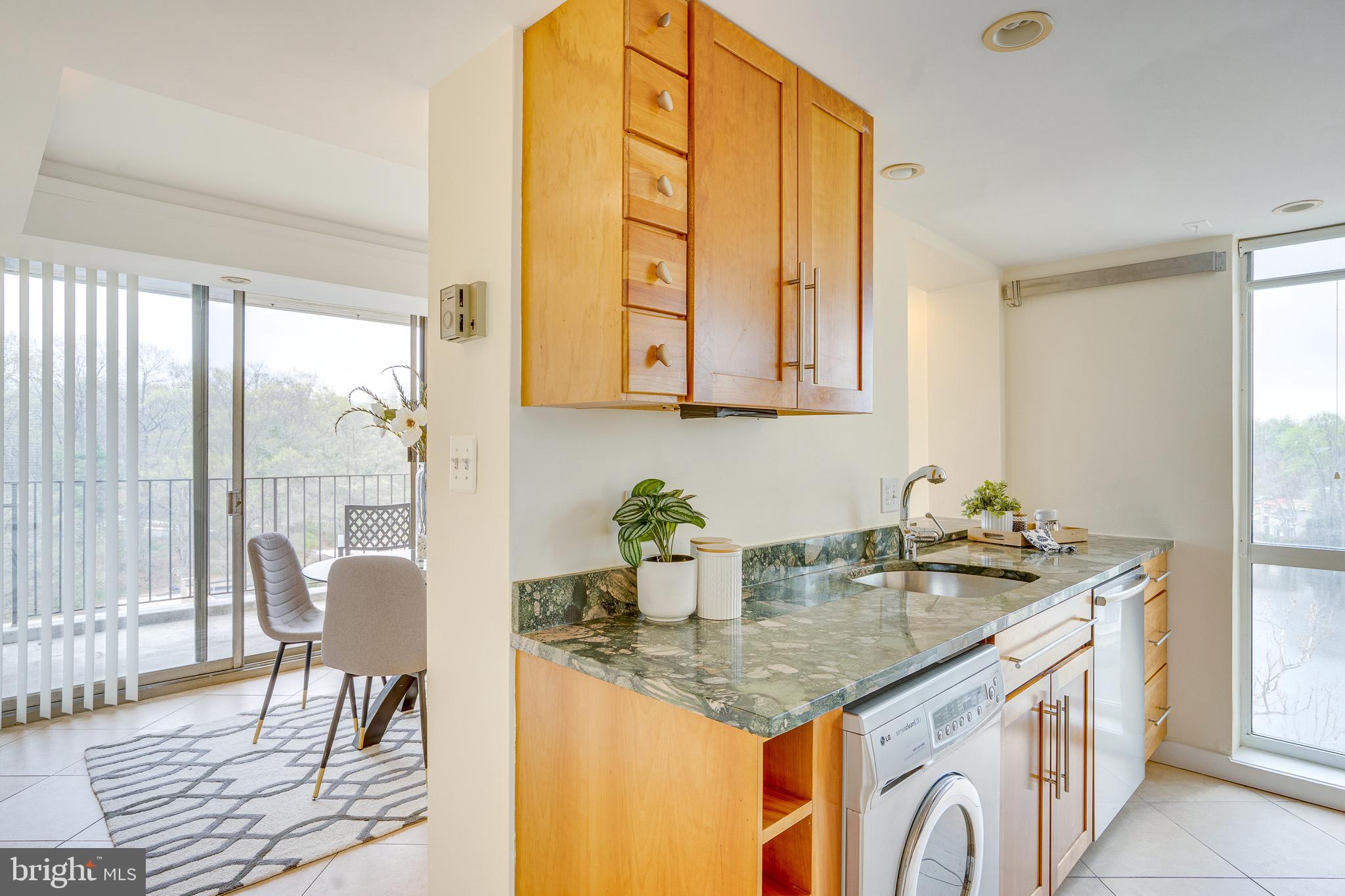 11400 Washington Plaza West, Unit 803 Reston, VA 20190 - Photo 13 of 43 a kitchen with stainless steel appliances granite countertop a sink and a window