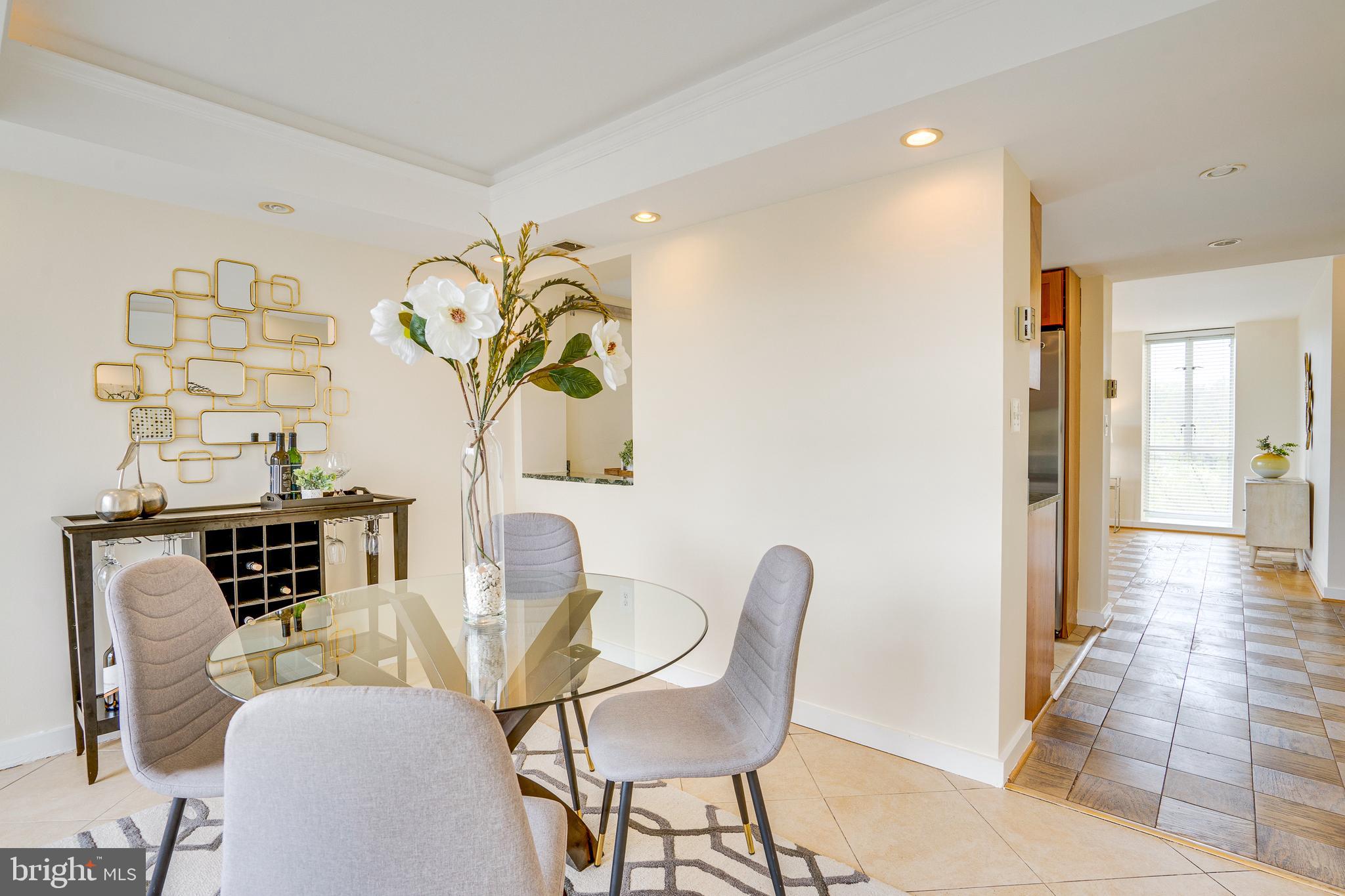 11400 Washington Plaza West, Unit 803 Reston, VA 20190 - Photo 19 of 43 a view of a dining room with furniture and wooden floor