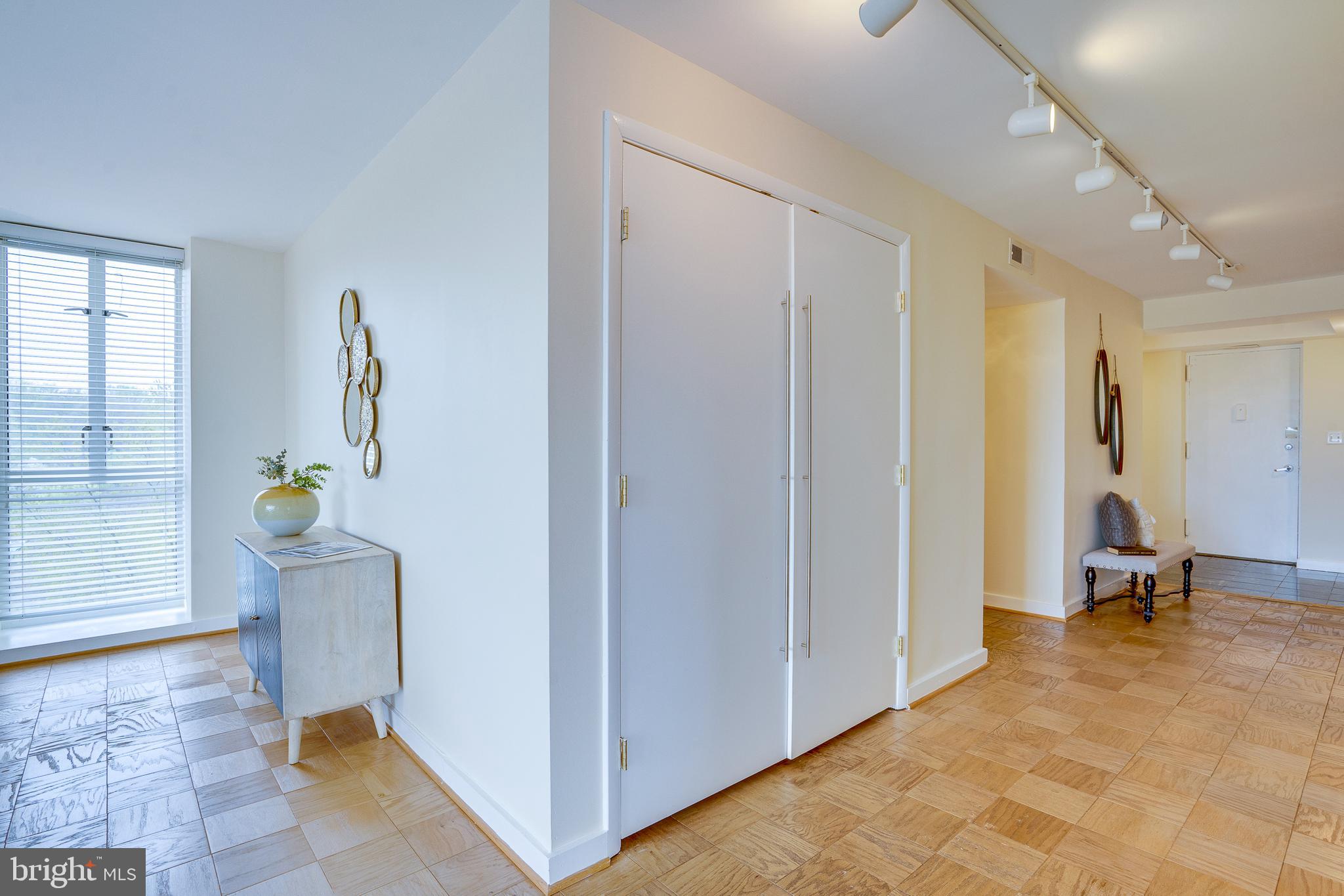 11400 Washington Plaza West, Unit 803 Reston, VA 20190 - Photo 26 of 43 a view of room with wooden floor and chair