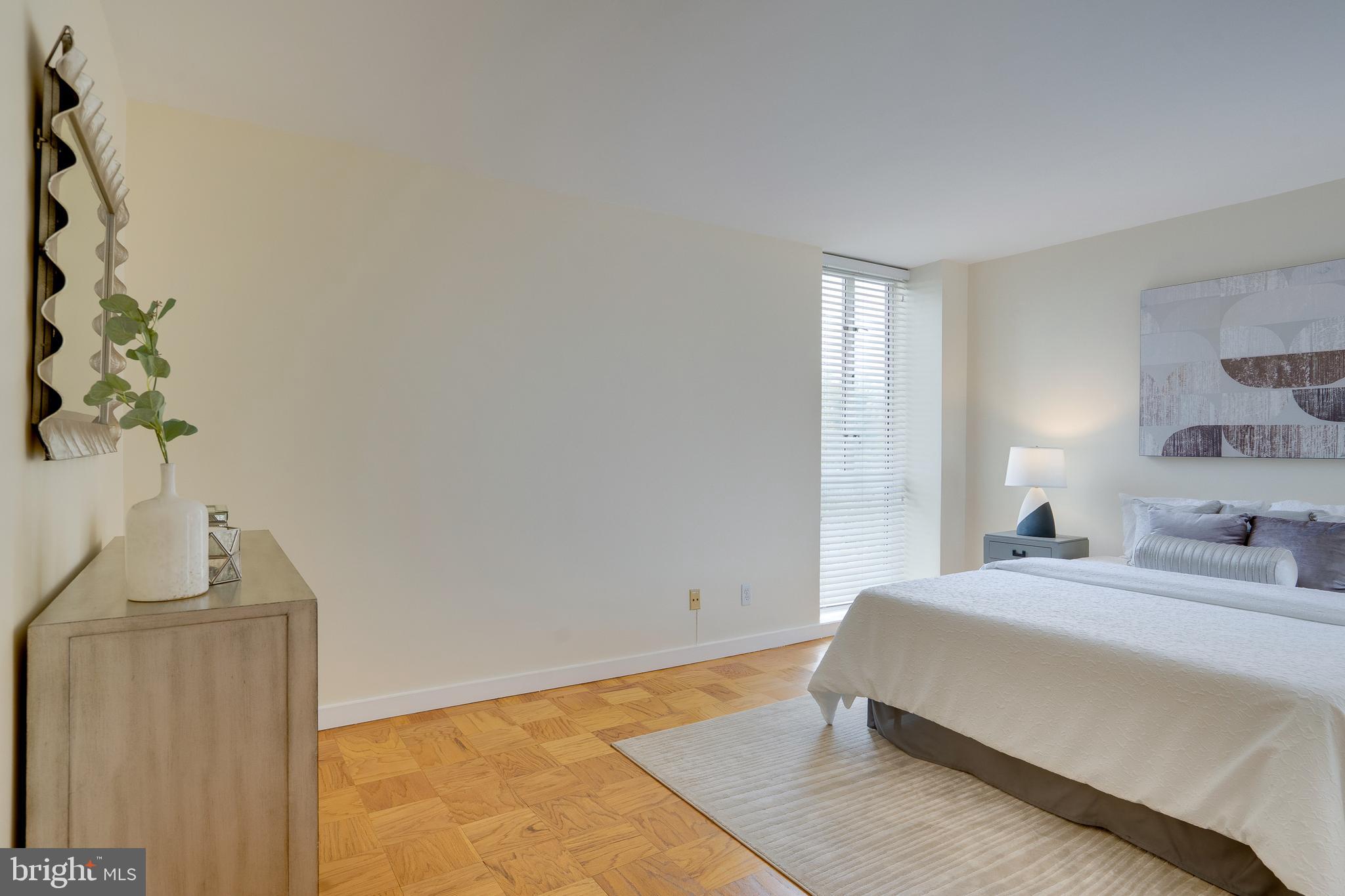 11400 Washington Plaza West, Unit 803 Reston, VA 20190 - Photo 27 of 43 a bedroom with a bed and a window
