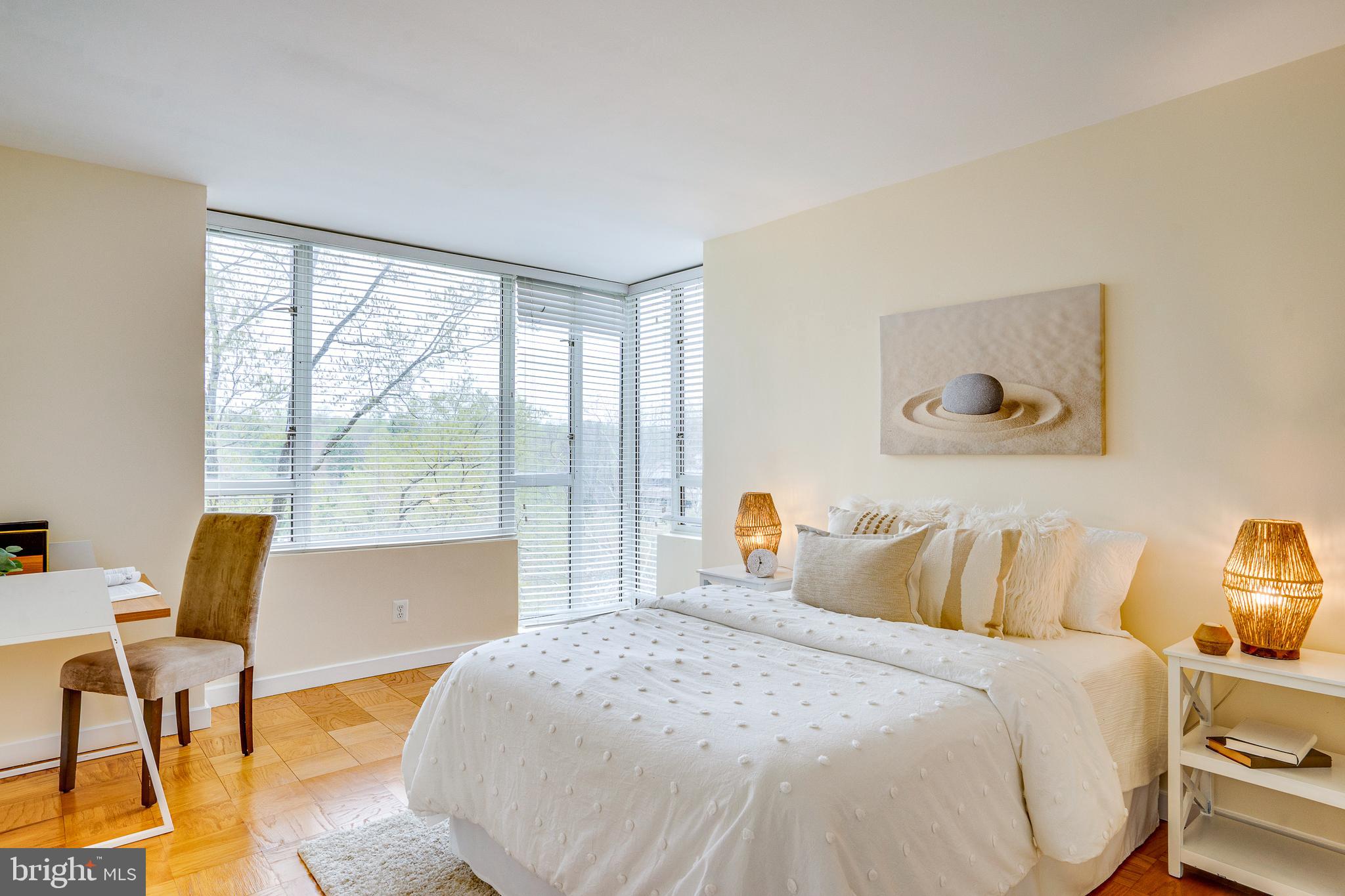 11400 Washington Plaza West, Unit 803 Reston, VA 20190 - Photo 31 of 43 a bedroom with a bed and wooden floor