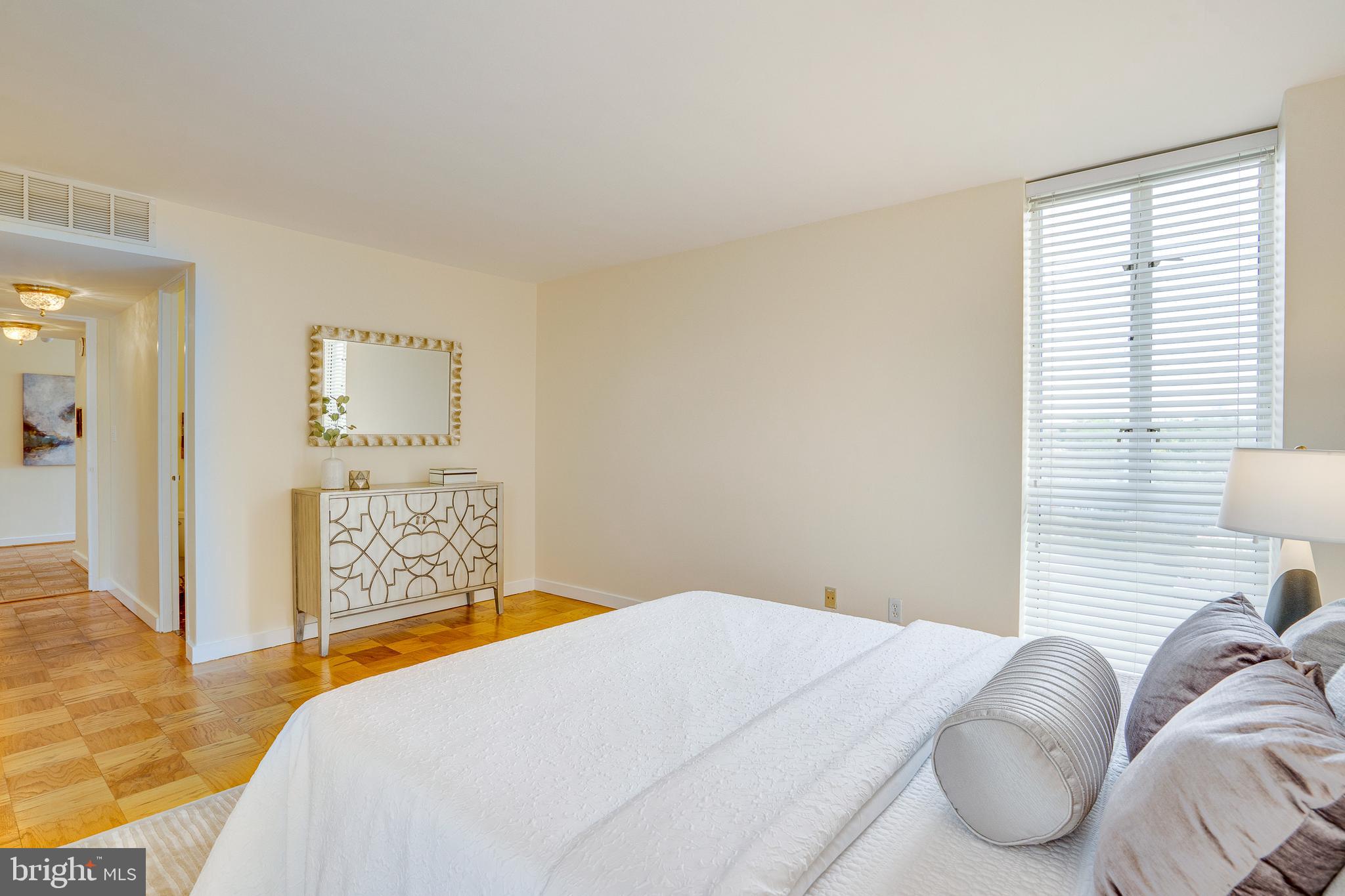 11400 Washington Plaza West, Unit 803 Reston, VA 20190 - Photo 34 of 43 a bedroom with a bed and a cabinets