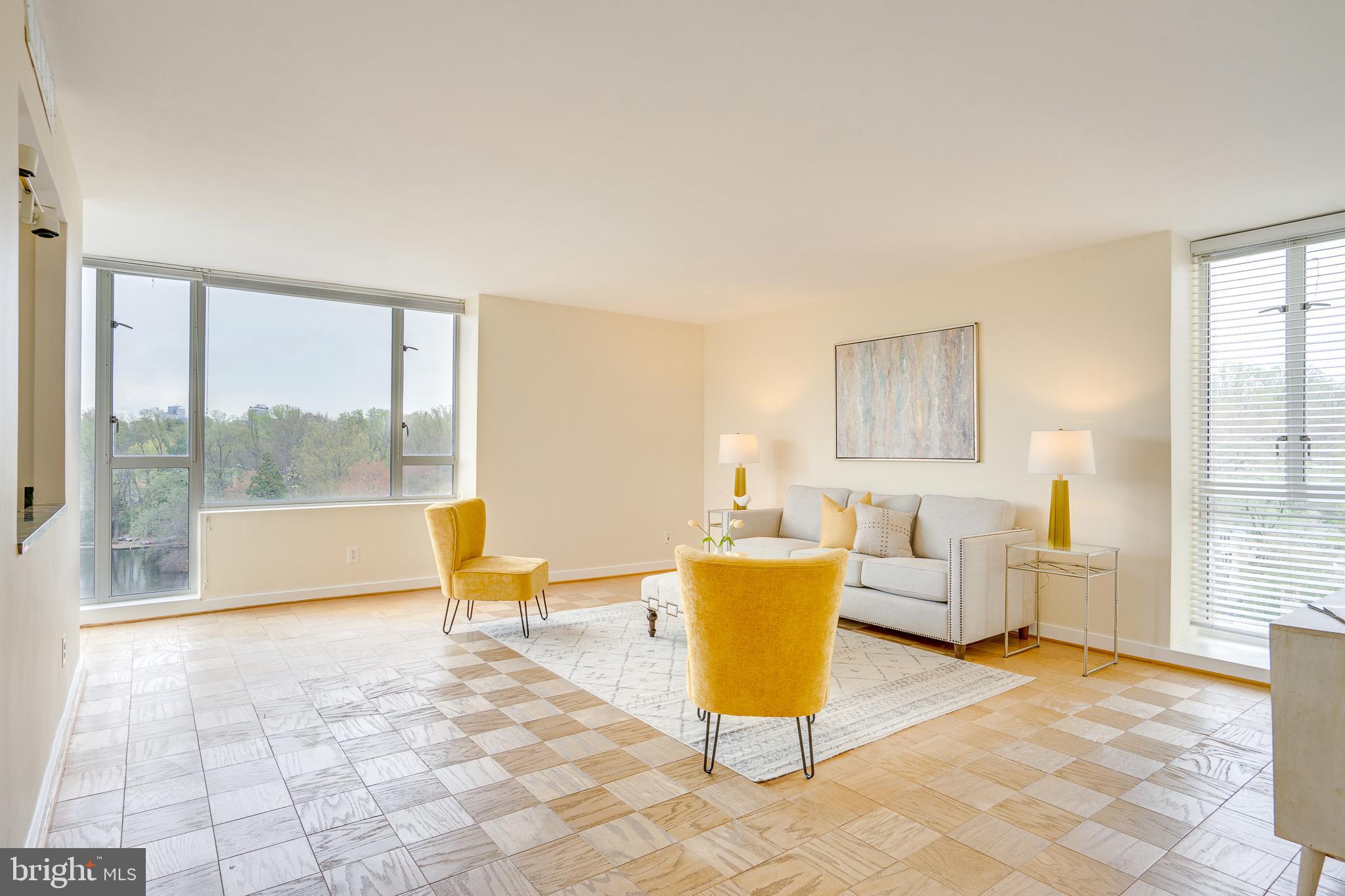 11400 Washington Plaza West, Unit 803 Reston, VA 20190 - Photo 5 of 43 a living room with fireplace furniture and a large window