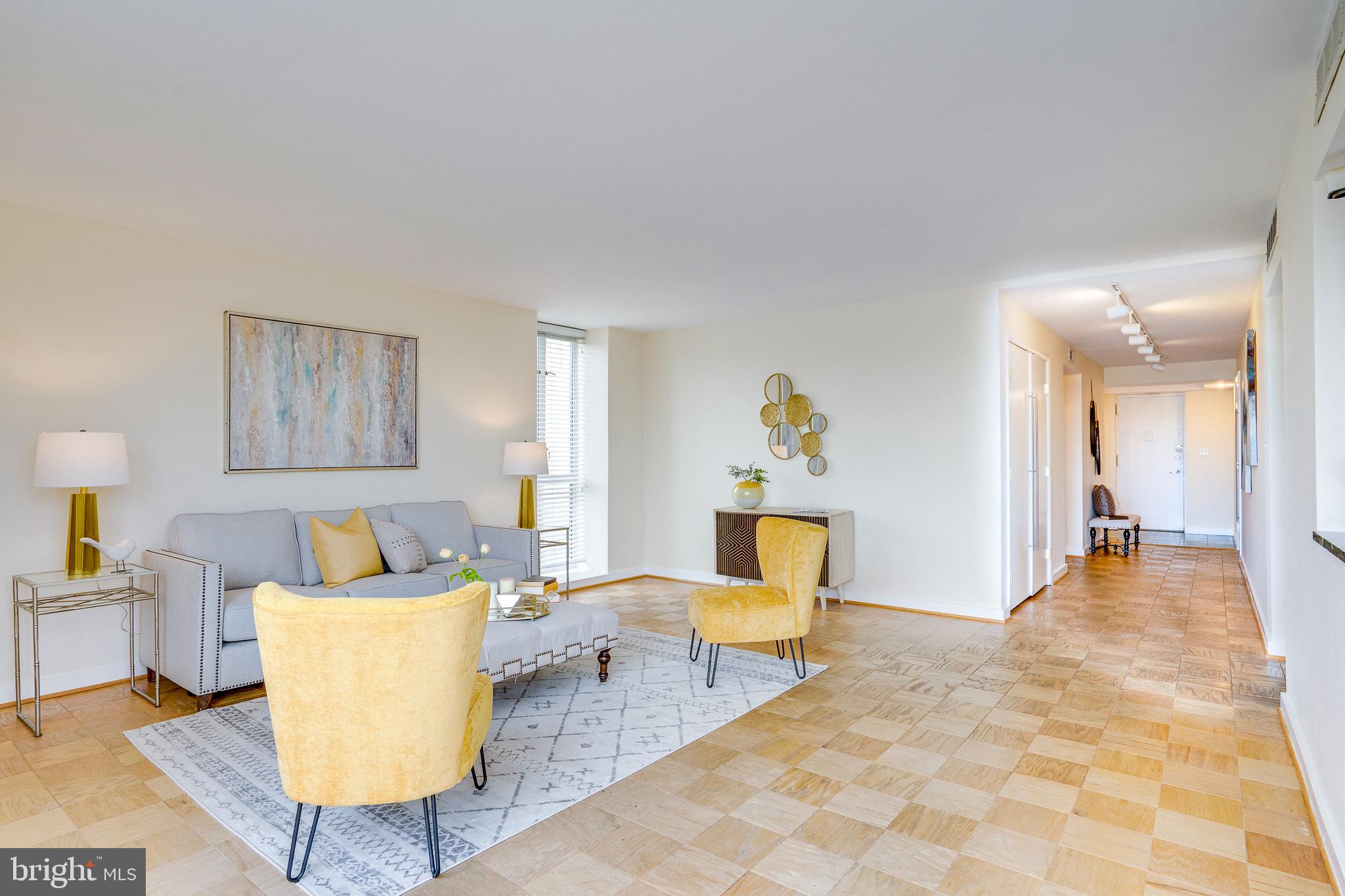 11400 Washington Plaza West, Unit 803 Reston, VA 20190 - Photo 8 of 43 a living room with furniture and a table