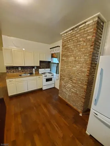 a view of kitchen with wooden floor