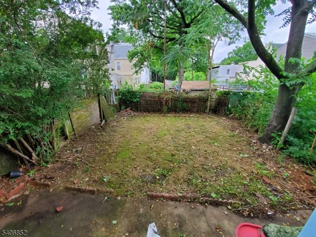 a view of backyard with outdoor space