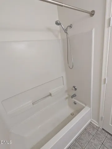 a bathroom with a bath tub and a shower