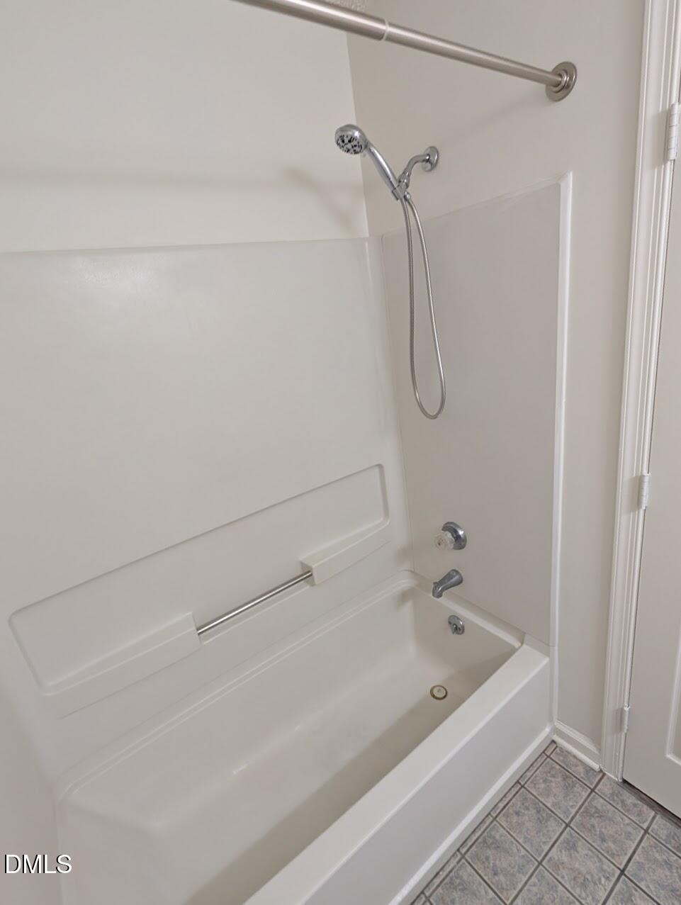 2020 Quaker Landing, Unit 103 Raleigh, NC 27603 - Photo 13 of 19 a bathroom with a bath tub and a shower