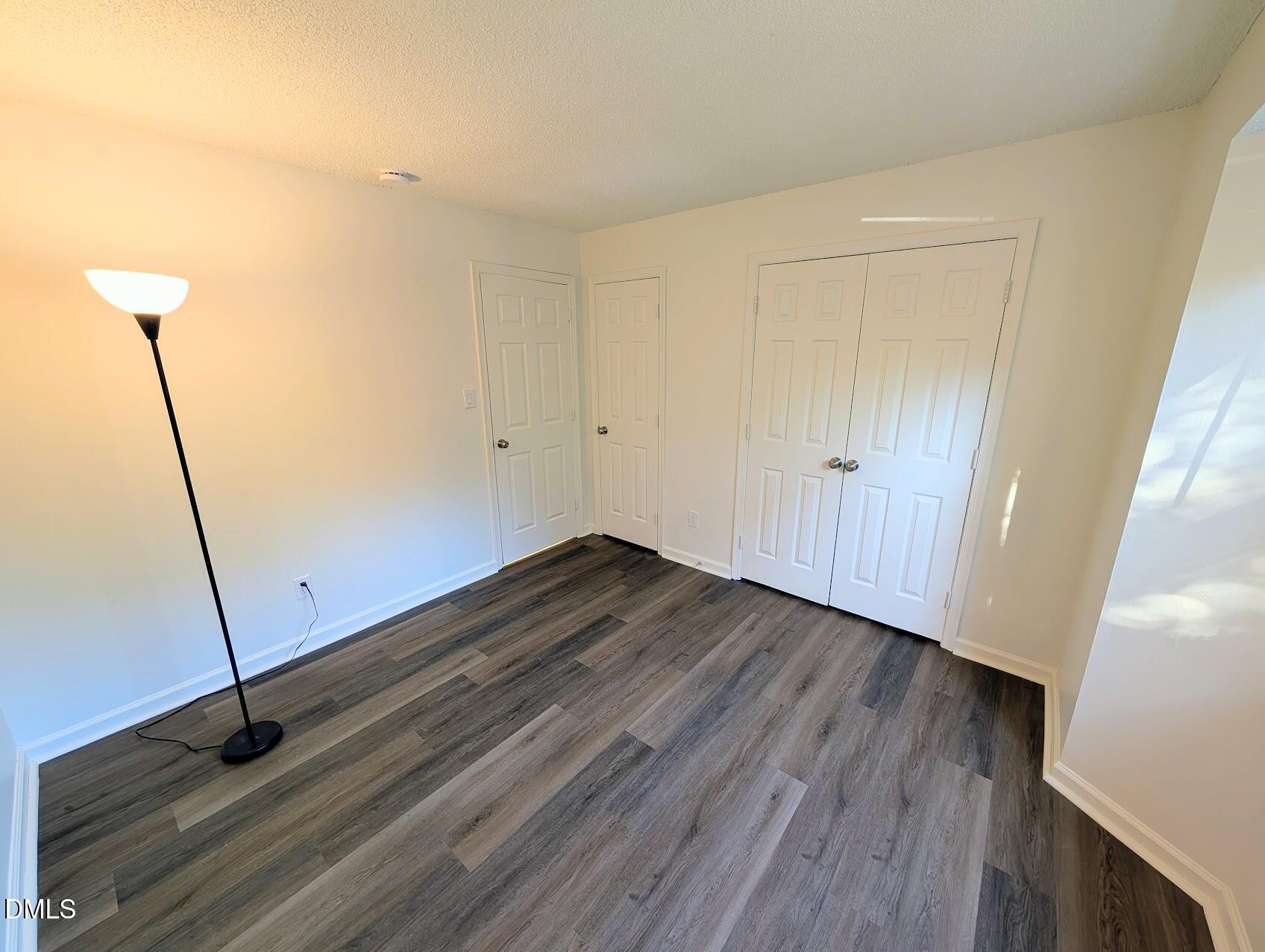 2020 Quaker Landing, Unit 103 Raleigh, NC 27603 - Photo 10 of 19 a view of a room with wooden floor