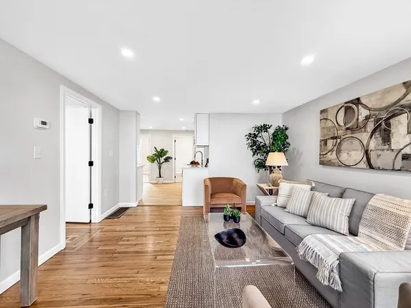a living room with furniture and a table