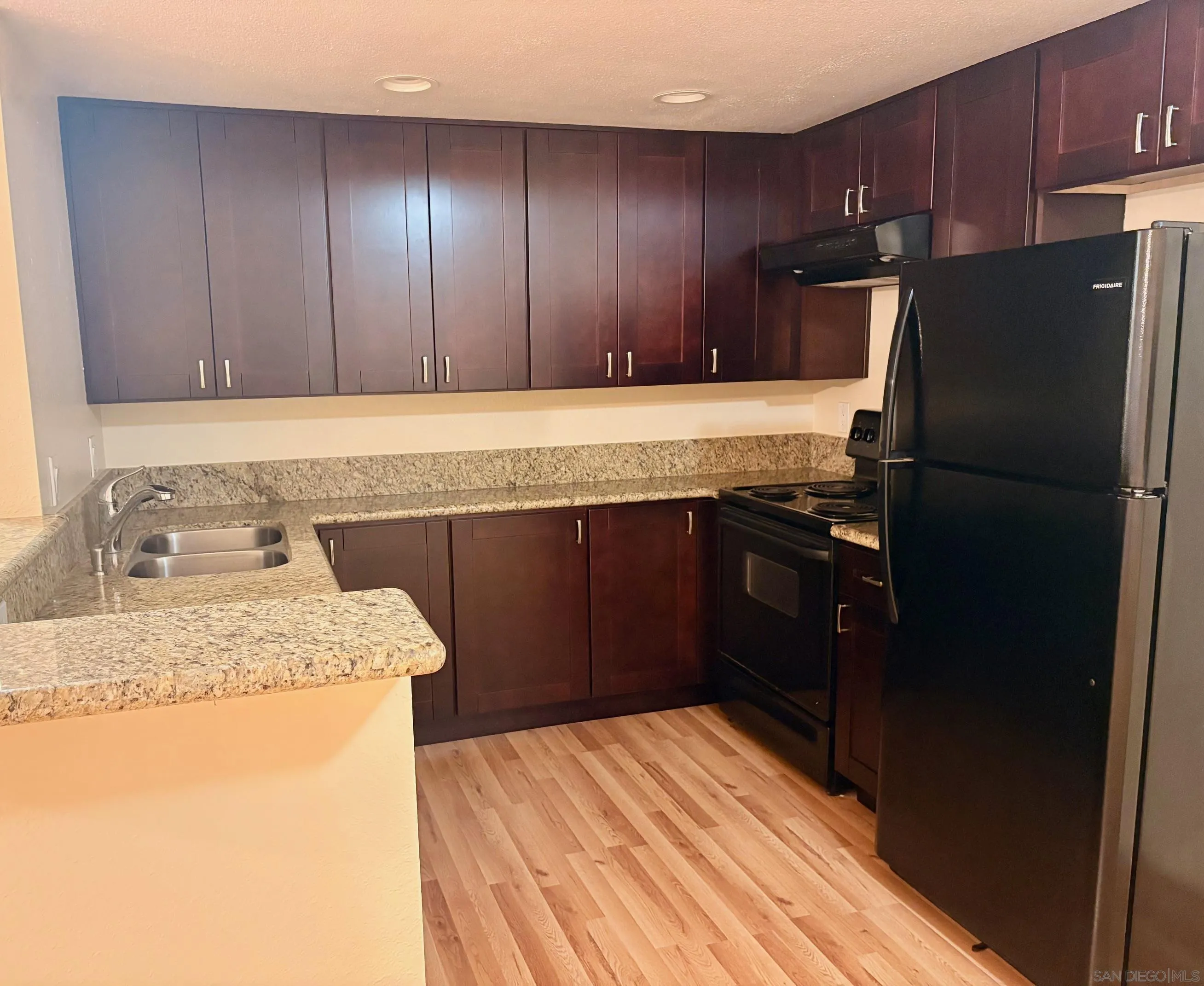 5946 Rancho Mission Road, Unit 149 San Diego, CA 92108 - Photo 6 of 23 Upgraded Kitchen w/ New Cabinetry, Counters & Lighting