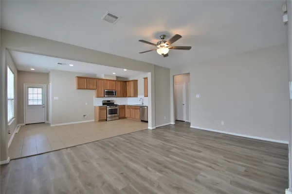 a view of a livingroom with a kitchen