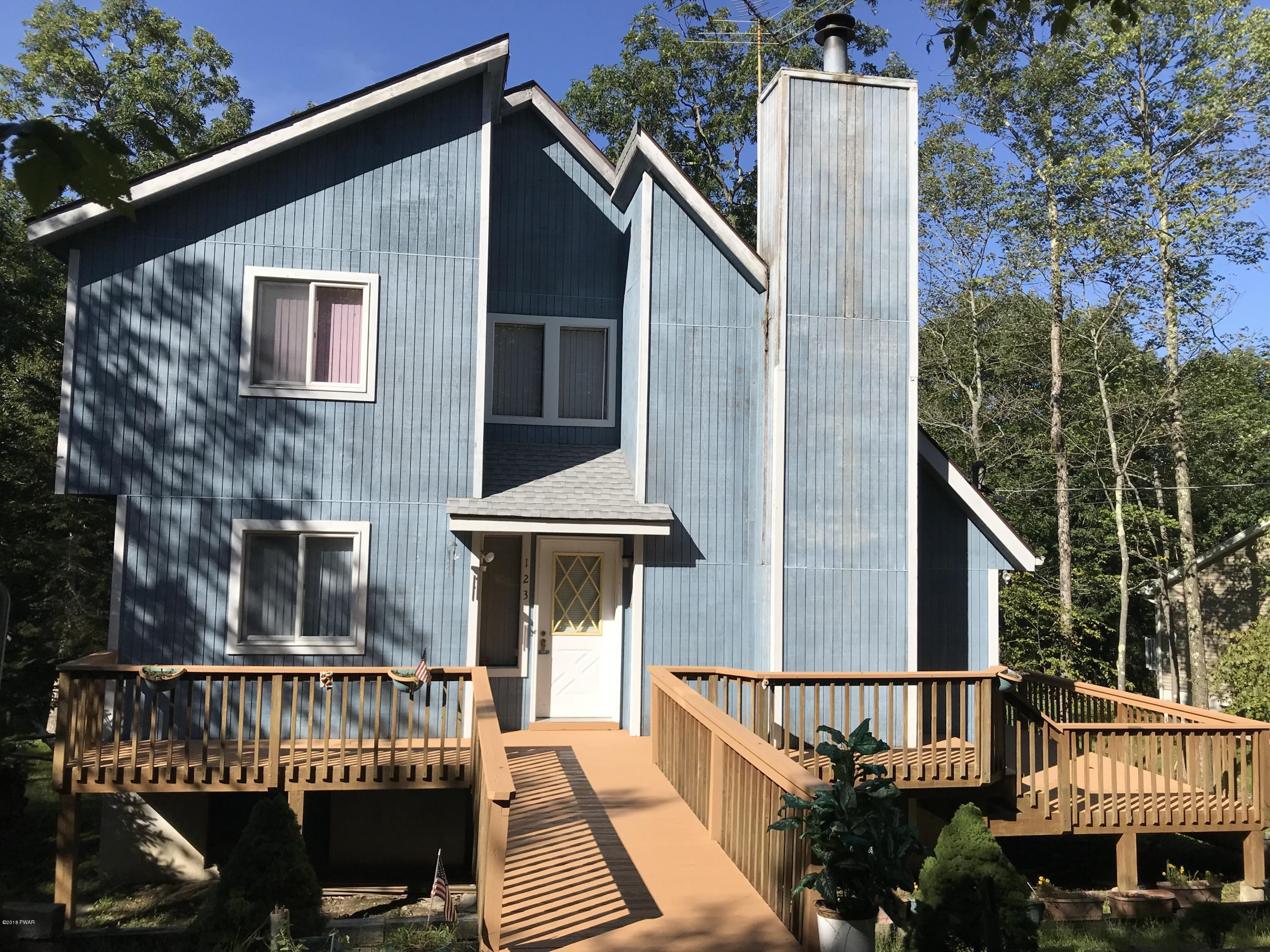 123 Stonehenge Road Milford, PA 18337 - Photo 19 of 25 a front view of a house with a deck