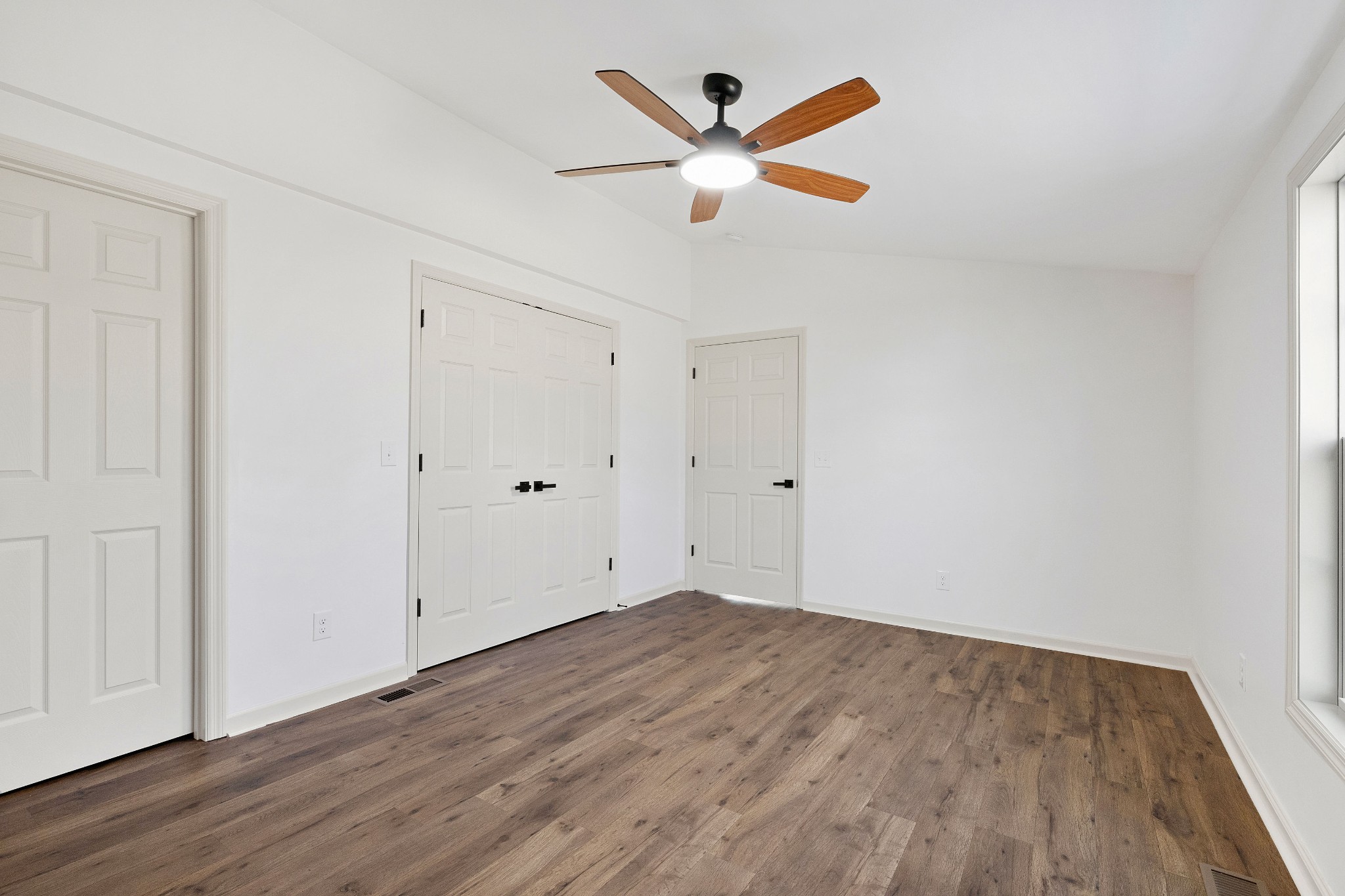 462 Circle Drive Prospect, TN 38477 - Photo 12 of 29 an empty room with wooden floor and a ceiling fan