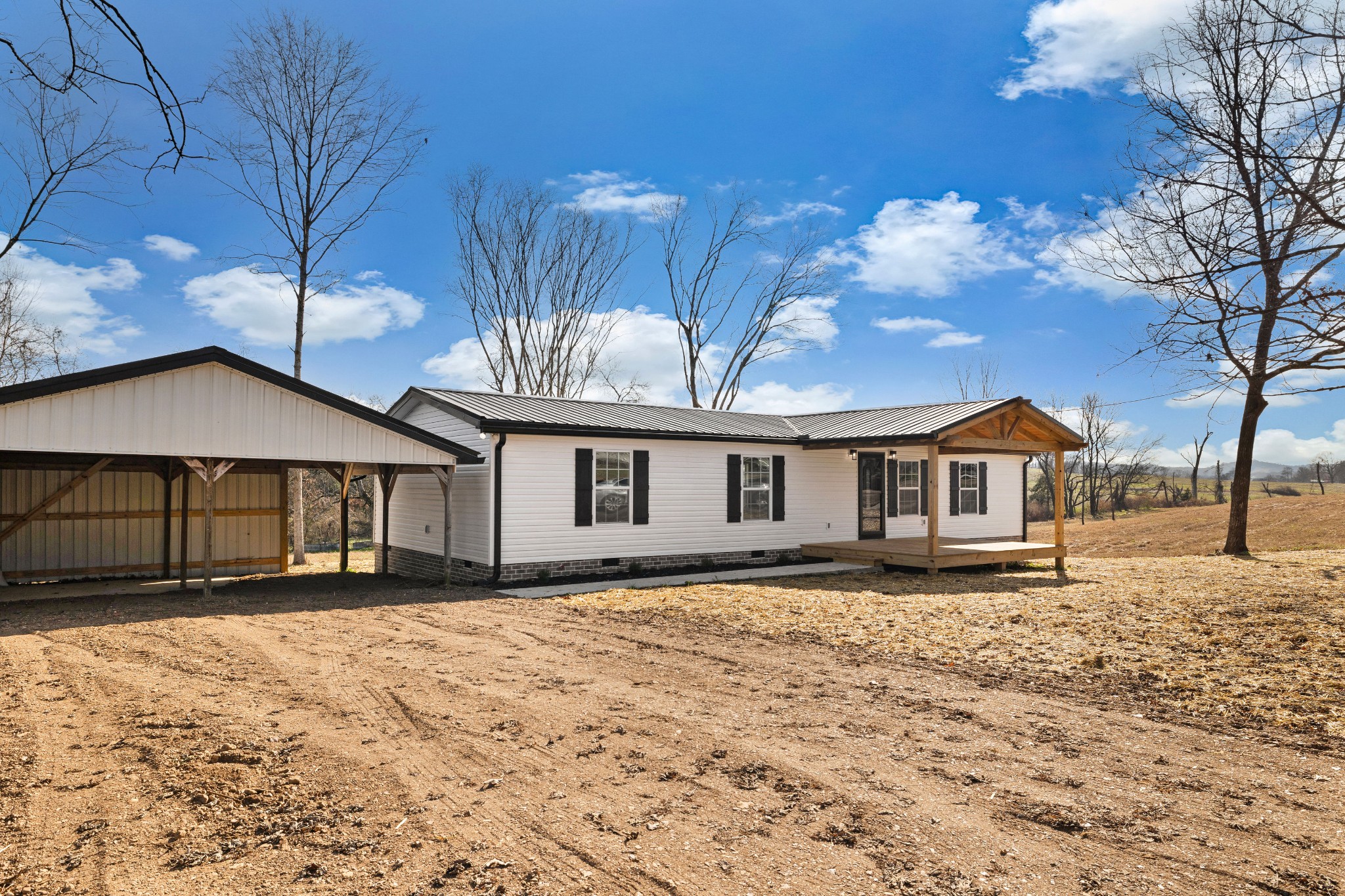 462 Circle Drive Prospect, TN 38477 - Photo 23 of 29 a front view of a house with a yard covered in snow