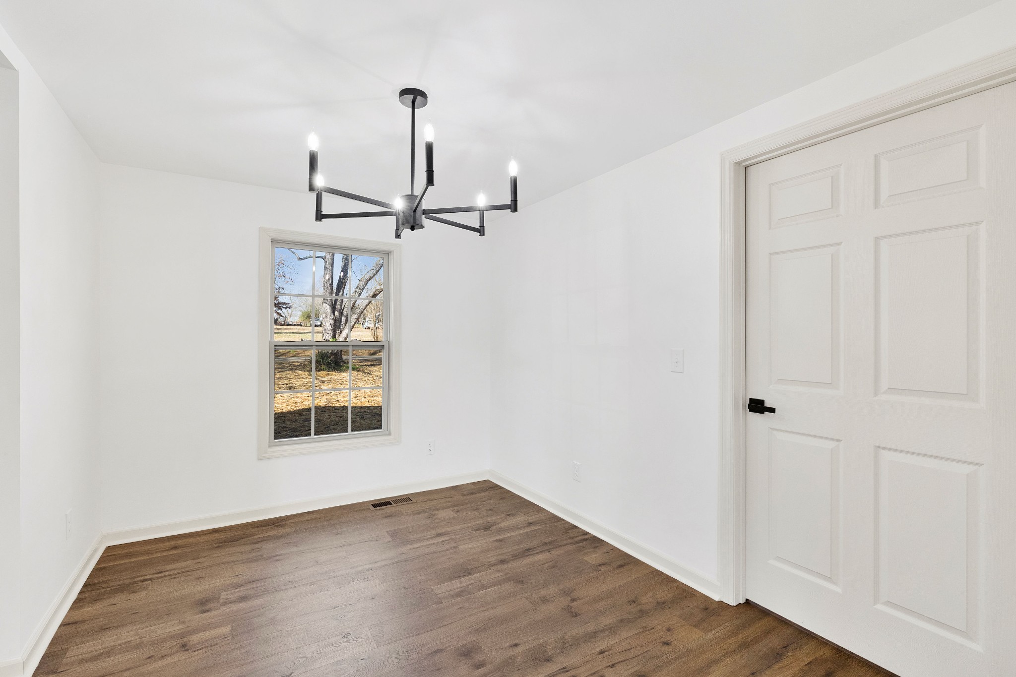 462 Circle Drive Prospect, TN 38477 - Photo 10 of 29 an empty room with wooden floor closet and windows