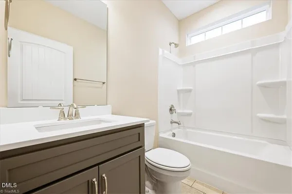 a bathroom with a sink a toilet and a bathtub