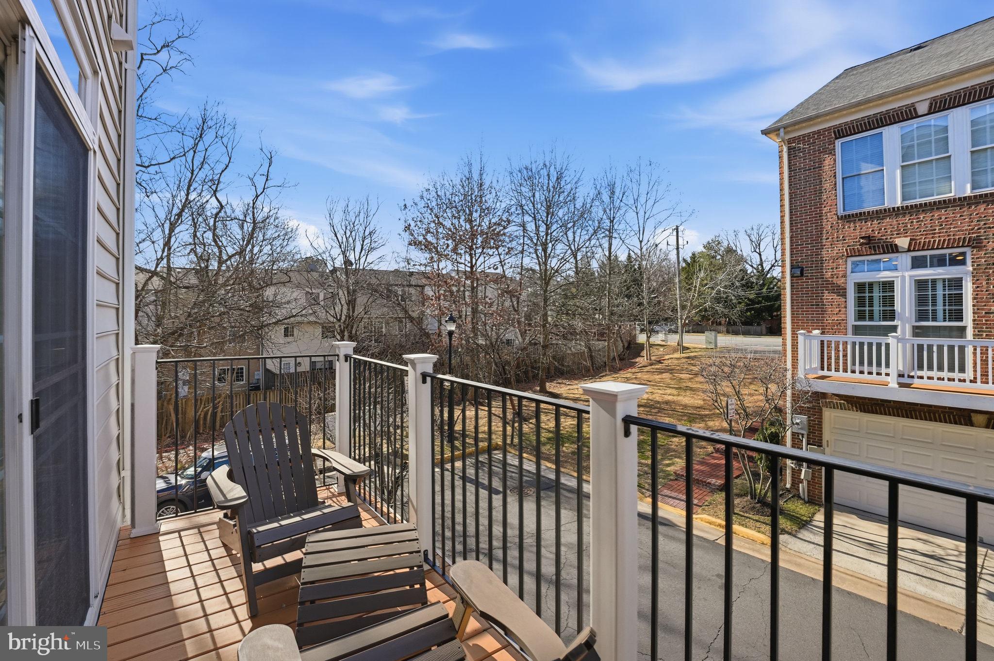 8015 Reserve Way Vienna, VA 22182 - Photo 23 of 58 a view of a balcony with wooden fence