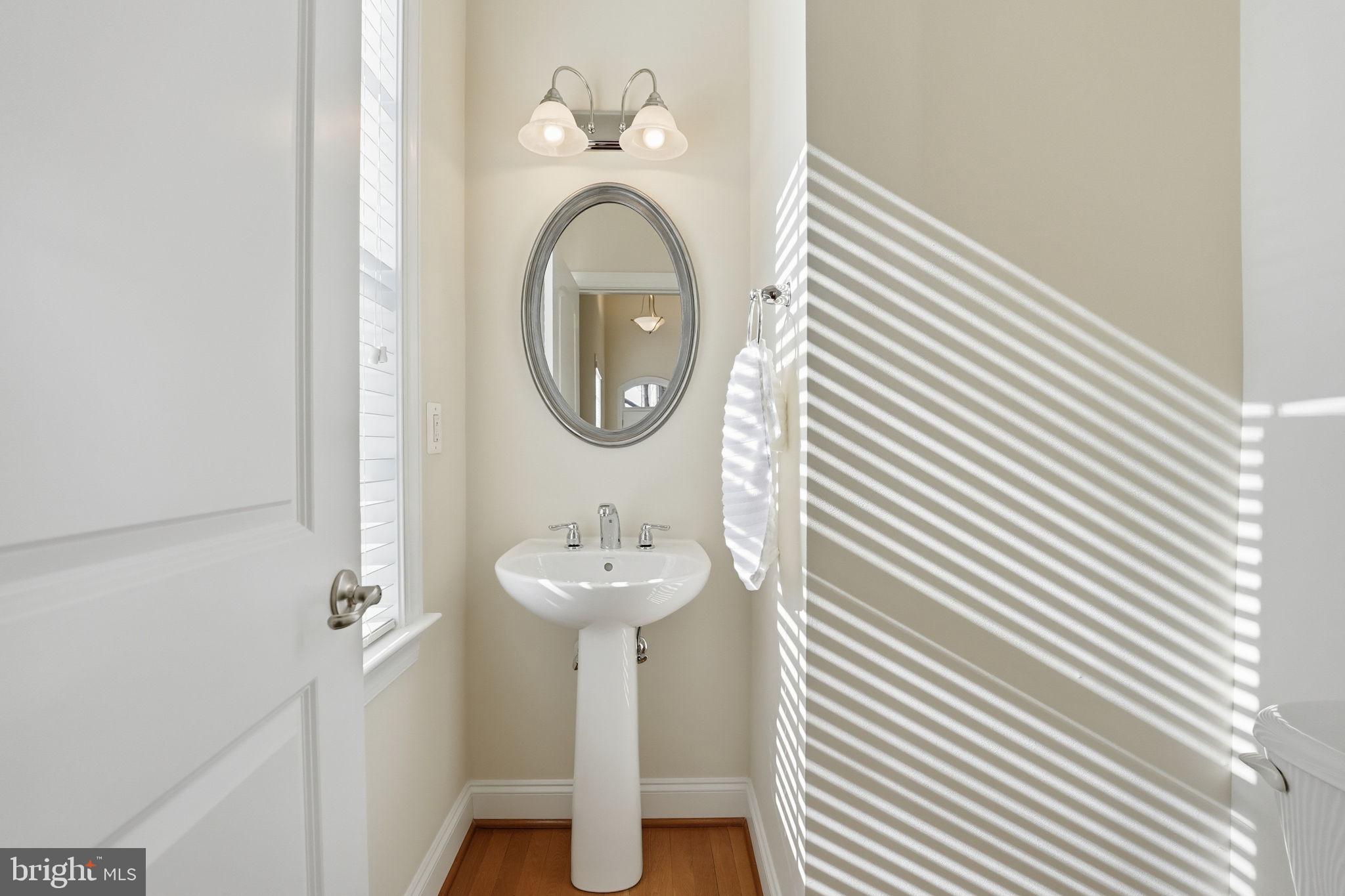 8015 Reserve Way Vienna, VA 22182 - Photo 4 of 58 a bathroom with a sink and a mirror