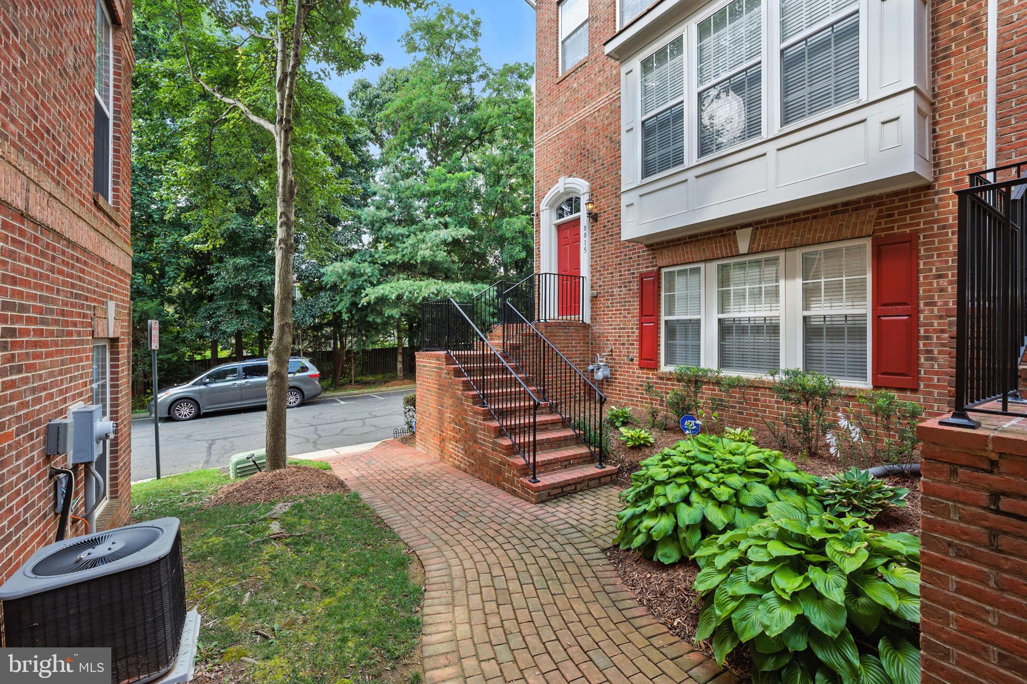 8015 Reserve Way Vienna, VA 22182 - Photo 43 of 58 a view of a patio with table and chairs and potted plants