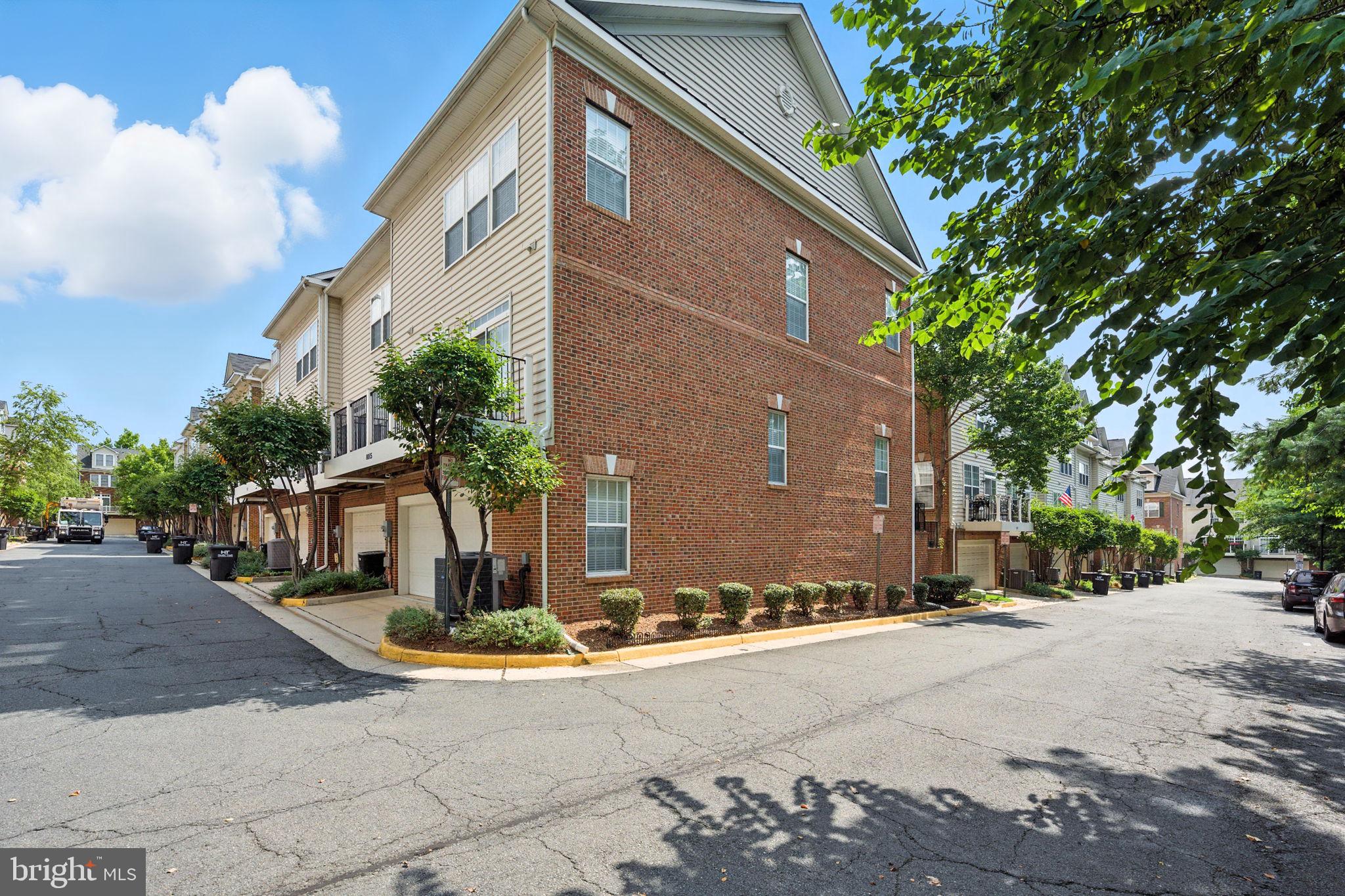 8015 Reserve Way Vienna, VA 22182 - Photo 46 of 58 a front view of a house with a yard