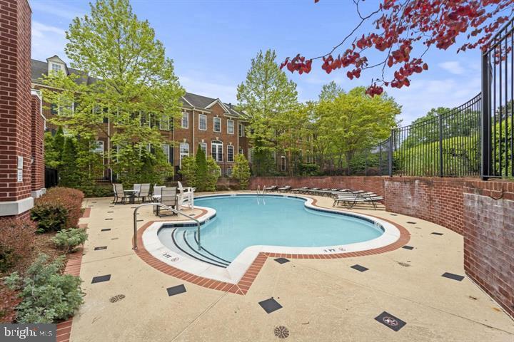 8015 Reserve Way Vienna, VA 22182 - Photo 52 of 58 a view of a swimming pool with outdoor seating and plants