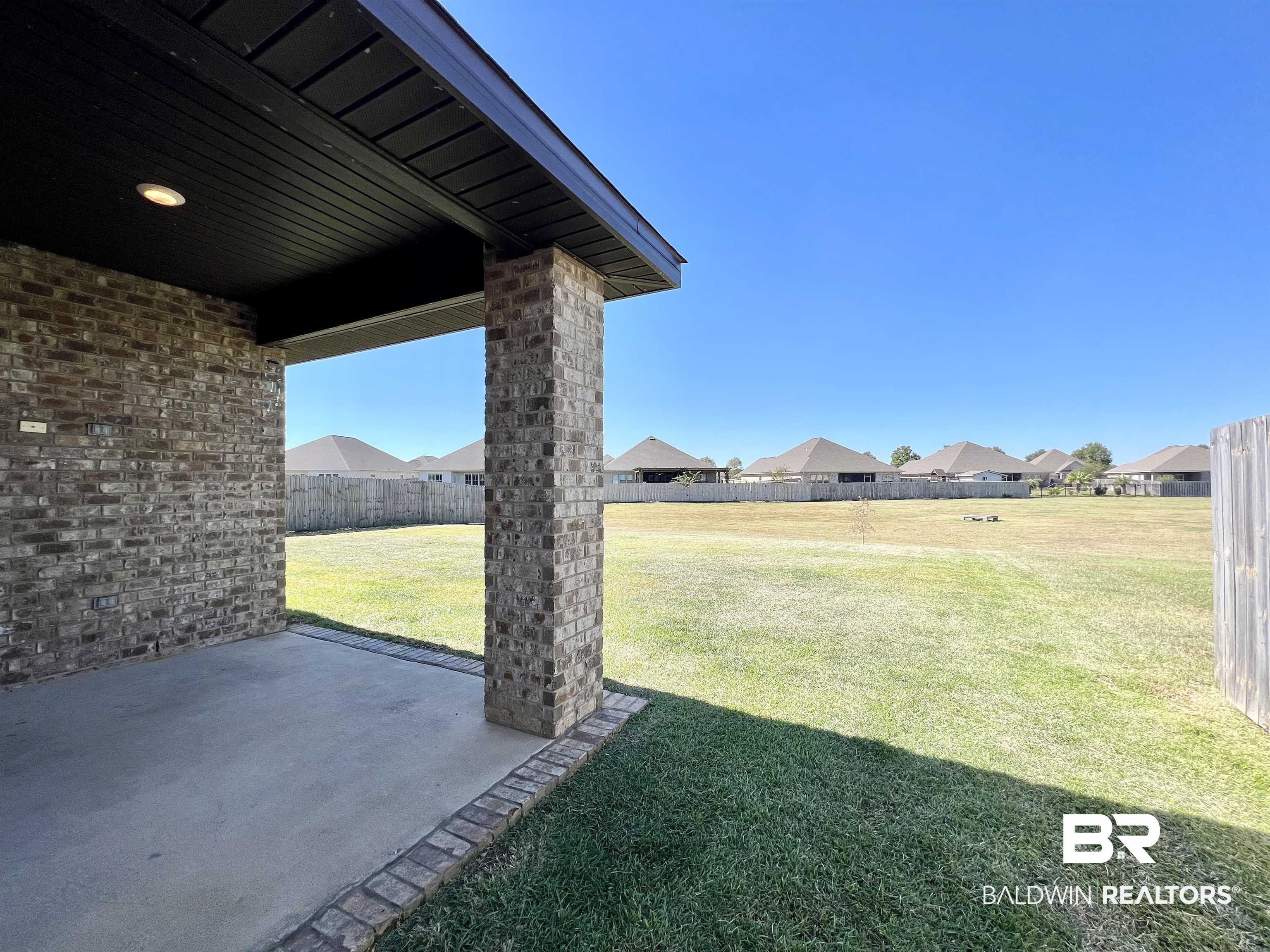 24785 Slater Mill Road Daphne, AL 36526 - Photo 38 of 46 View of yard featuring a patio area