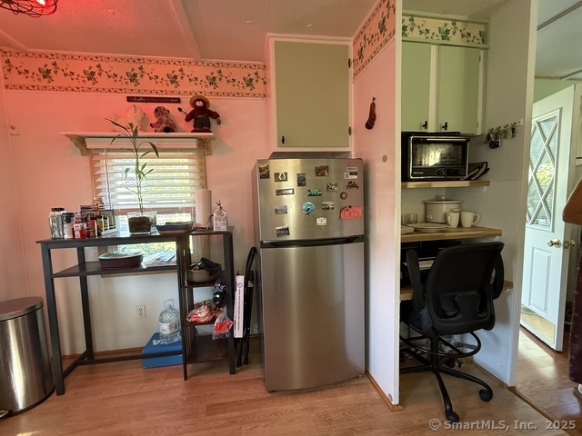 10 Whitewood Road Killingworth, CT 06419 - Photo 4 of 12 a kitchen with a refrigerator and a stove top oven