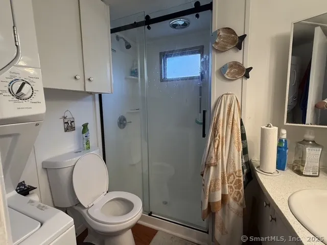 a bathroom with a toilet and a sink