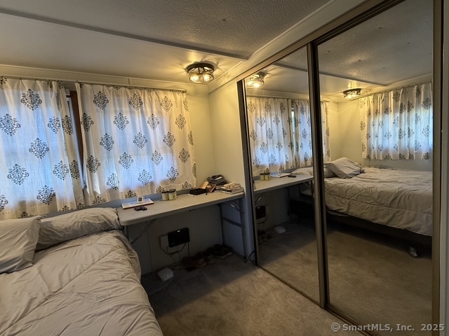 10 Whitewood Road Killingworth, CT 06419 - Photo 7 of 12 a bedroom with a bed and a table