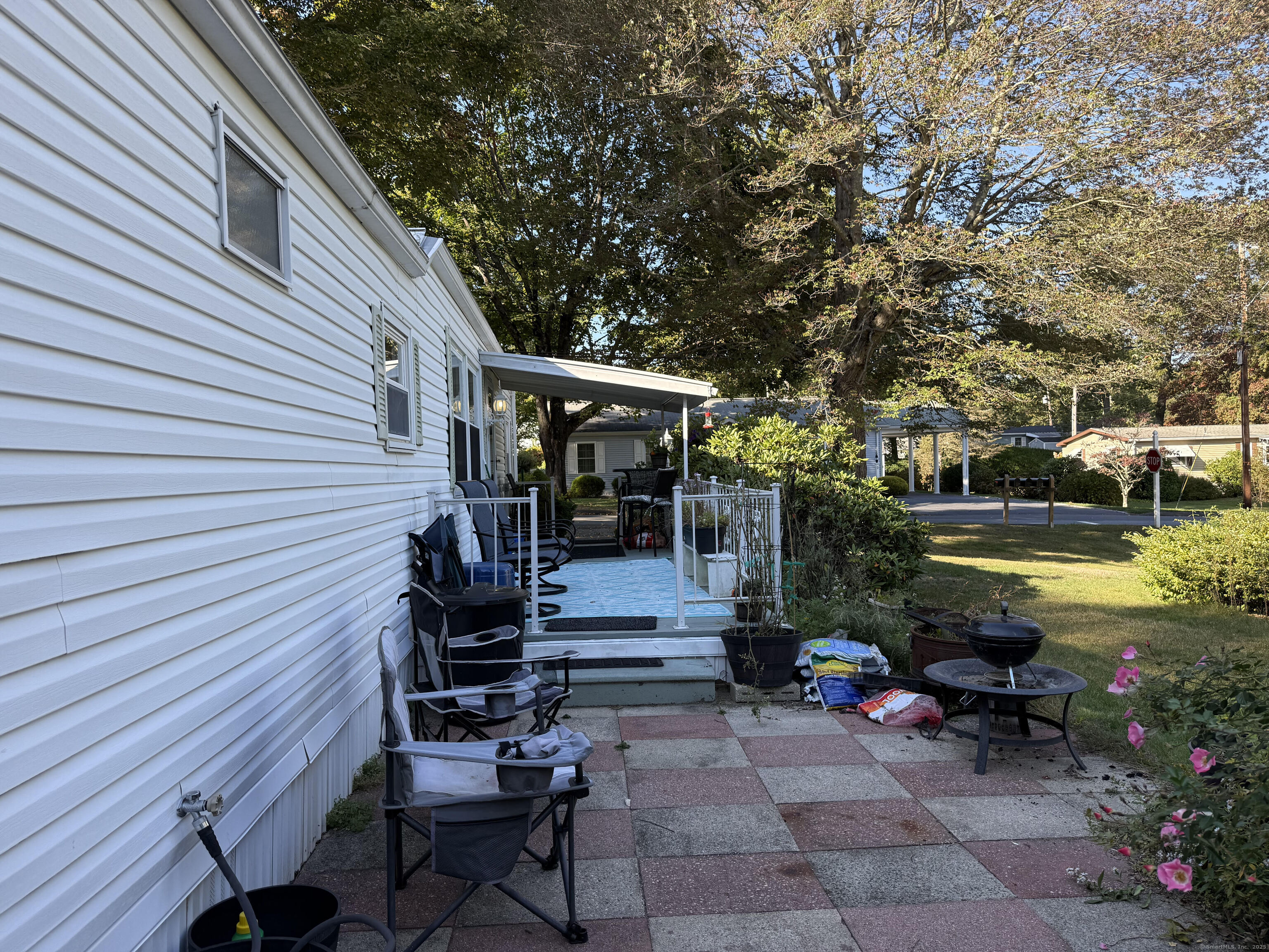 10 Whitewood Road Killingworth, CT 06419 - Photo 10 of 12 a view of a house with backyard and sitting area