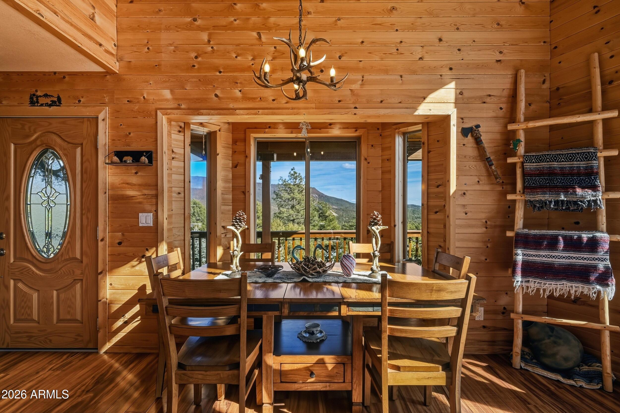 3119 Kysar Way Pine, AZ 85544 - Photo 6 of 68 a view of a dining room with furniture window and wooden floor