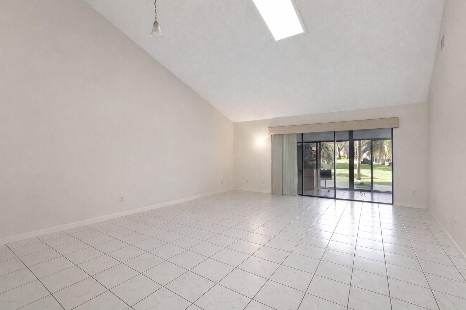 10884 Waterberry Court Boca Raton, FL 33498 - Photo 13 of 39 an empty room with windows