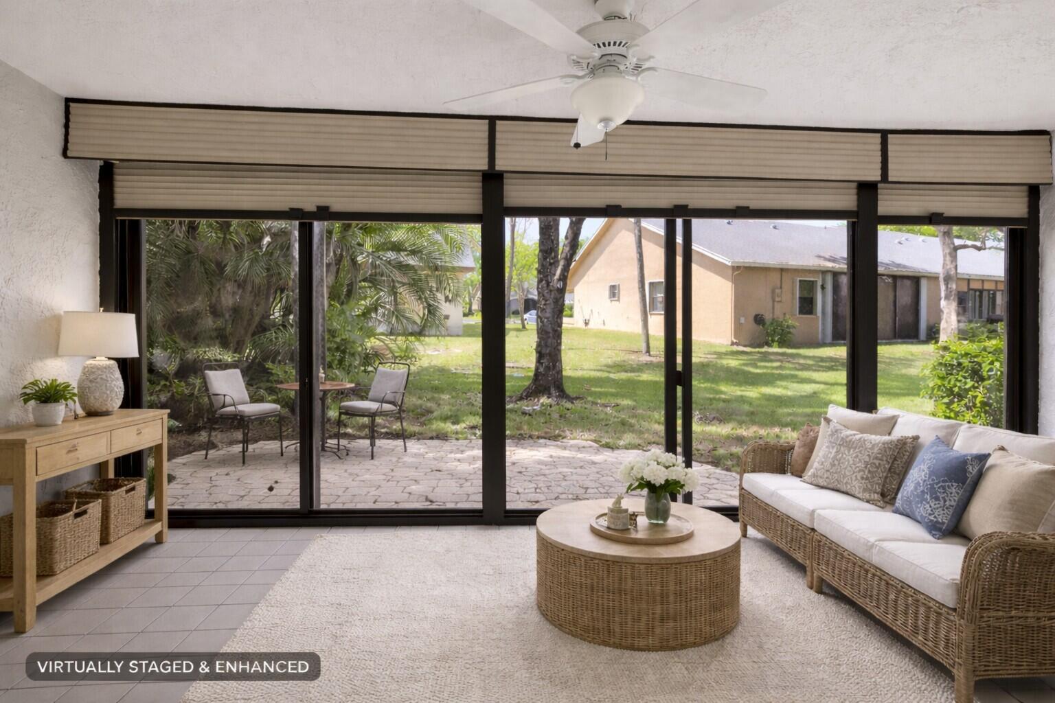 10884 Waterberry Court Boca Raton, FL 33498 - Photo 16 of 39 a living room with furniture and a floor to ceiling window
