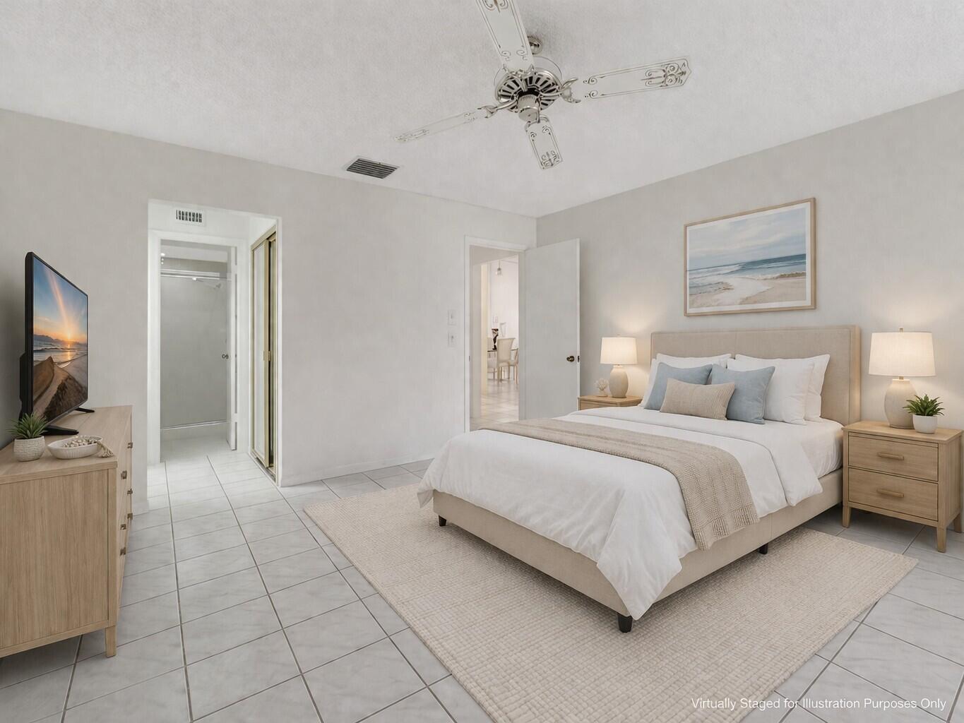 10884 Waterberry Court Boca Raton, FL 33498 - Photo 20 of 39 a spacious bedroom with a bed and a flat screen tv
