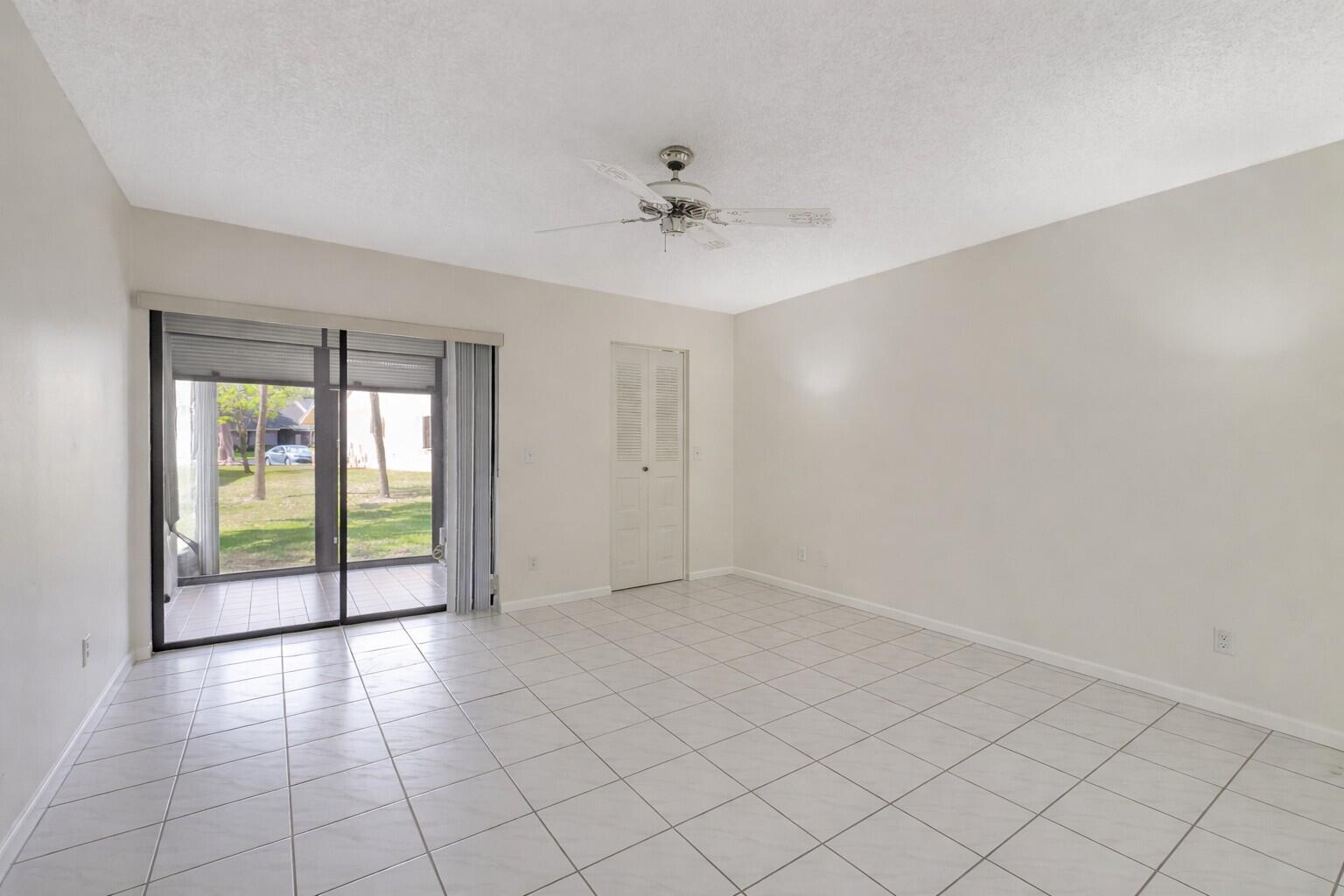 10884 Waterberry Court Boca Raton, FL 33498 - Photo 21 of 39 an empty room with windows