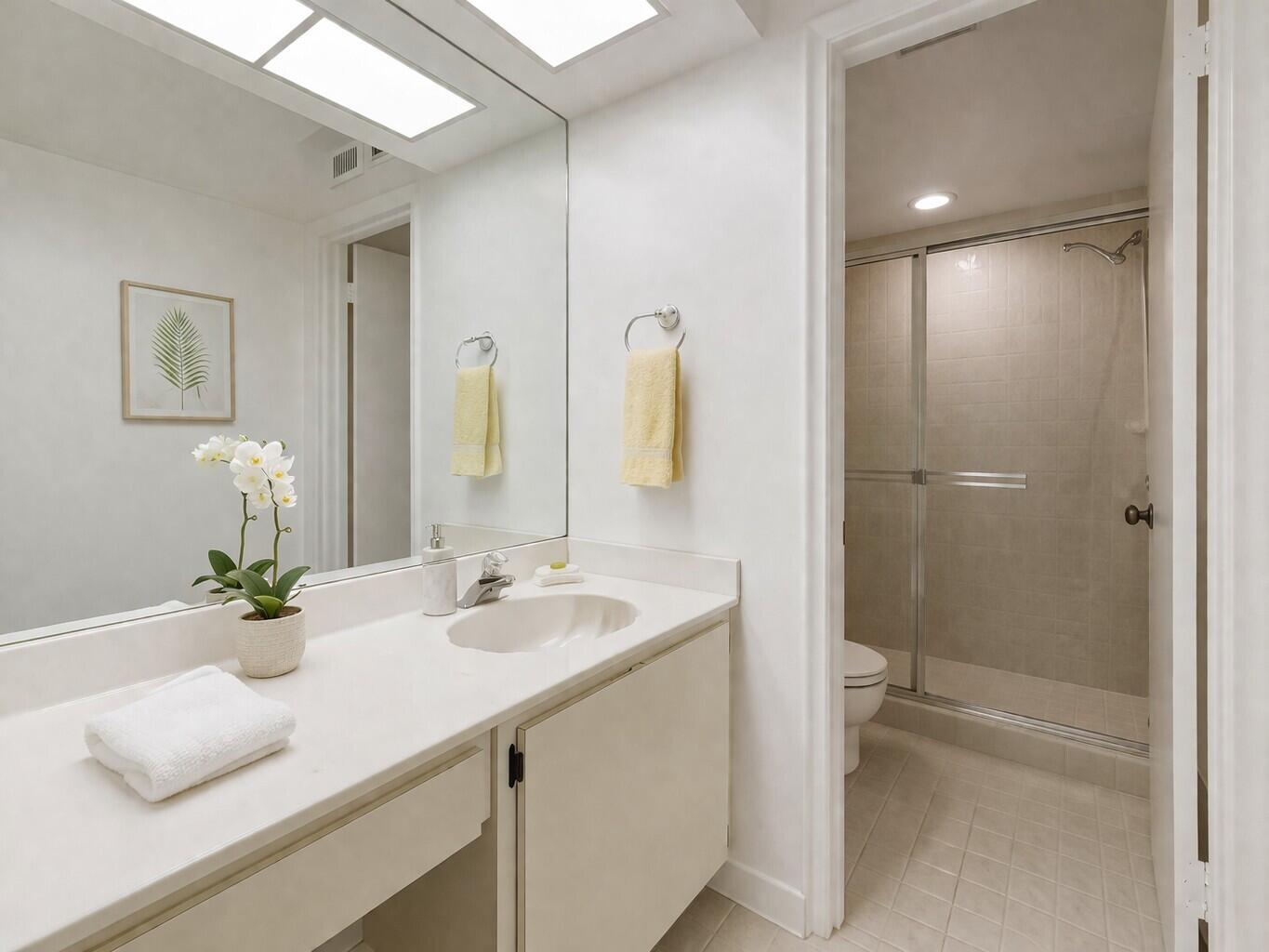 10884 Waterberry Court Boca Raton, FL 33498 - Photo 23 of 39 a bathroom with a sink and a mirror