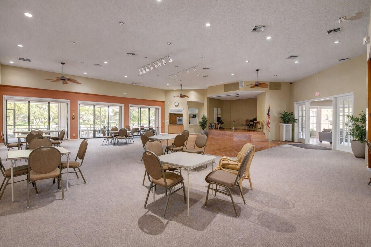 10884 Waterberry Court Boca Raton, FL 33498 - Photo 30 of 39 a living room with furniture and a large glass table
