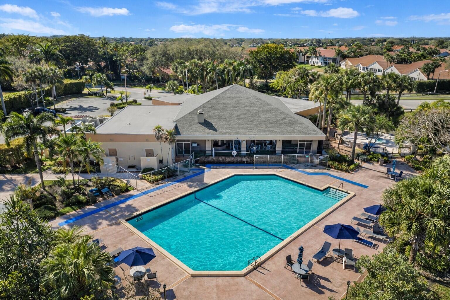 10884 Waterberry Court Boca Raton, FL 33498 - Photo 34 of 39 an aerial view of a house with swimming pool and mountains
