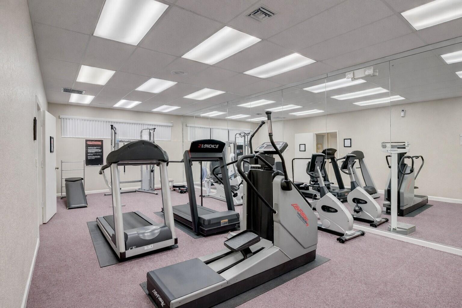 10884 Waterberry Court Boca Raton, FL 33498 - Photo 38 of 39 a view of a room with gym equipment