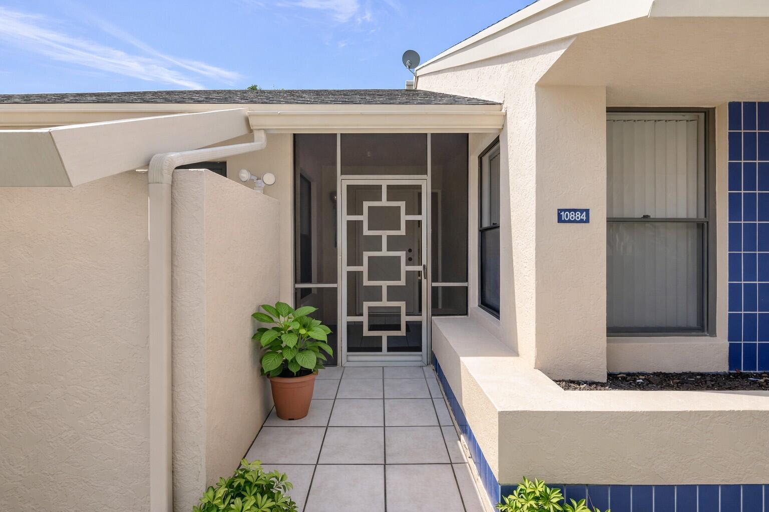 10884 Waterberry Court Boca Raton, FL 33498 - Photo 4 of 39 a view of a entryway door front of house
