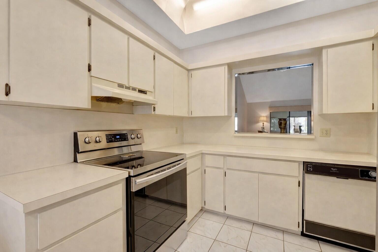 10884 Waterberry Court Boca Raton, FL 33498 - Photo 6 of 39 a kitchen with cabinets and appliances