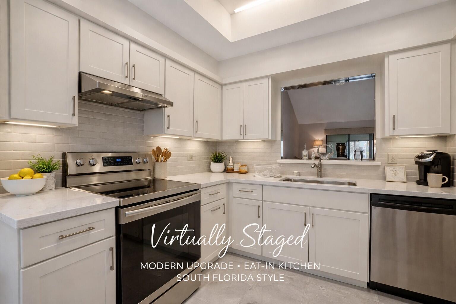 10884 Waterberry Court Boca Raton, FL 33498 - Photo 7 of 39 a kitchen with cabinets stainless steel appliances and a sink