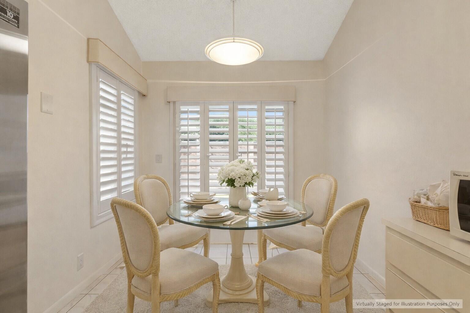 10884 Waterberry Court Boca Raton, FL 33498 - Photo 10 of 39 a dining room with furniture and window