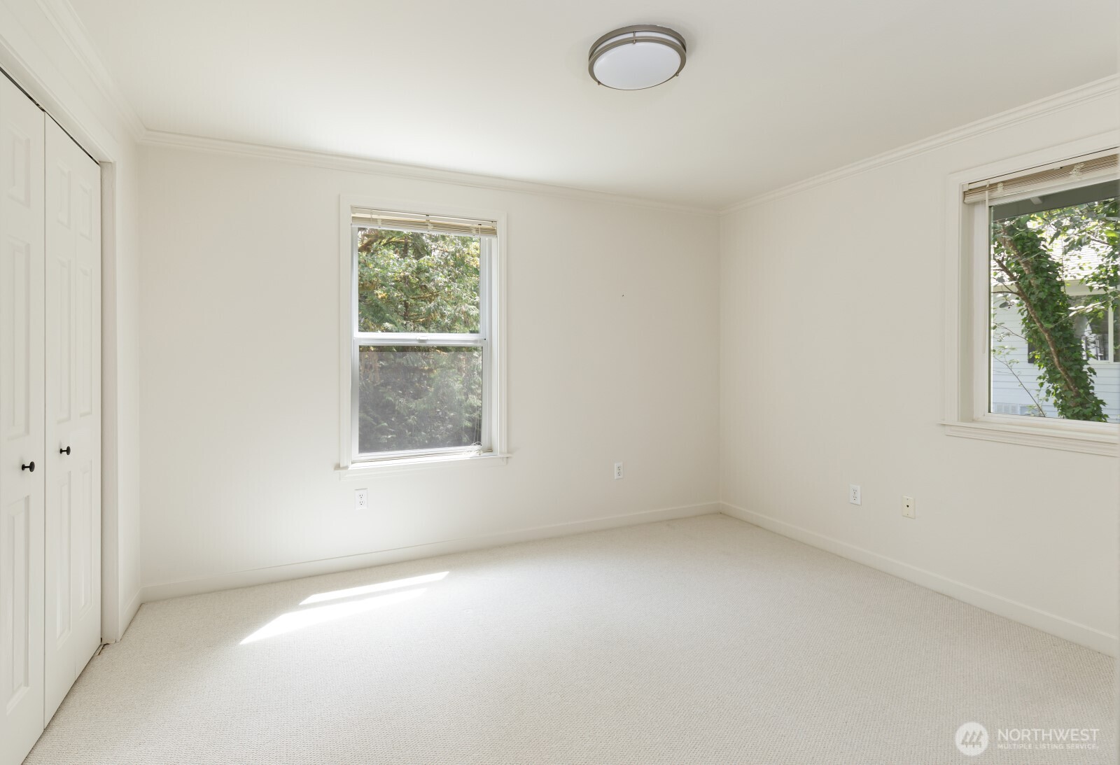 7605 Northeast Hidden Cove Road Bainbridge Island, WA 98110 - Photo 35 of 36 an empty room with a window