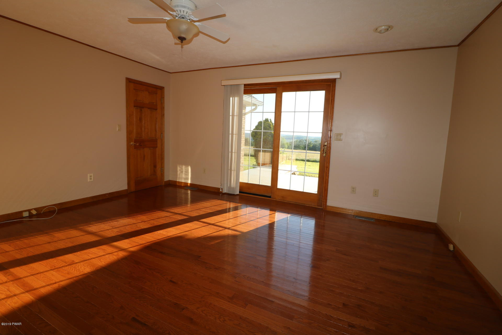53 Savitz Road Lake Ariel, PA 18436 - Photo 37 of 53 a view of empty room with wooden floor and fan