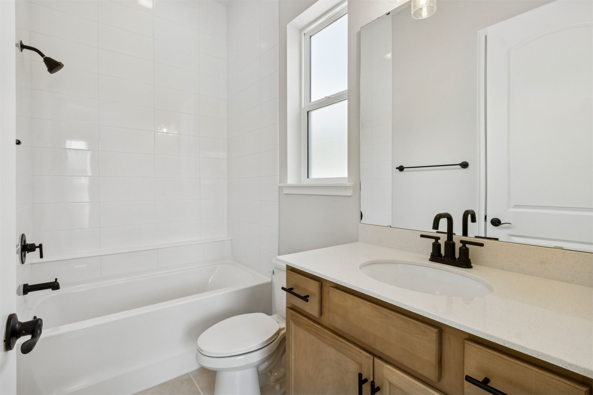 85228 Sandy Rdg Loop Yulee, FL 32097 - Photo 17 of 24 a bathroom with a sink a toilet and a bathtub