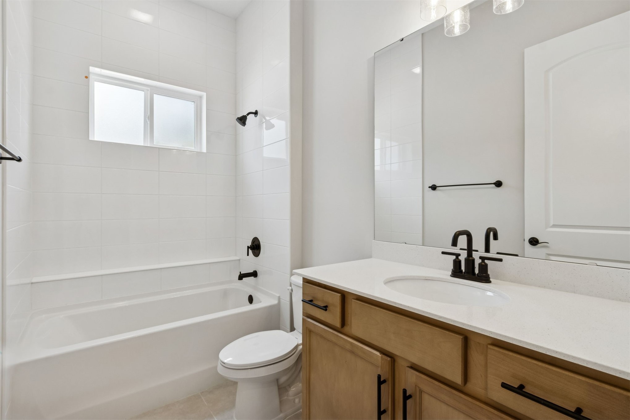85228 Sandy Rdg Loop Yulee, FL 32097 - Photo 19 of 24 a bathroom with a sink a toilet and a bathtub