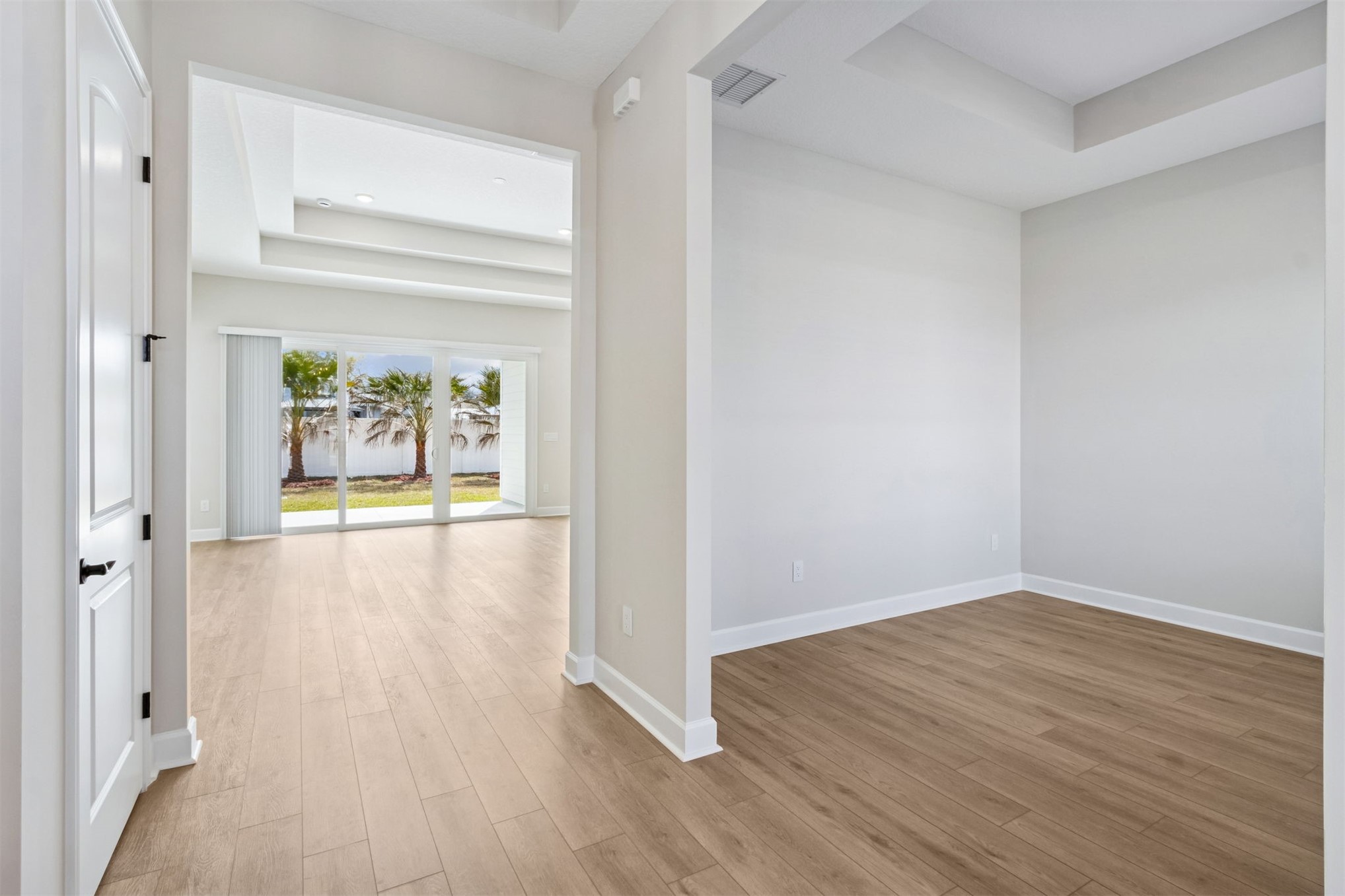 85228 Sandy Rdg Loop Yulee, FL 32097 - Photo 6 of 24 a view of a hallway with wooden floor