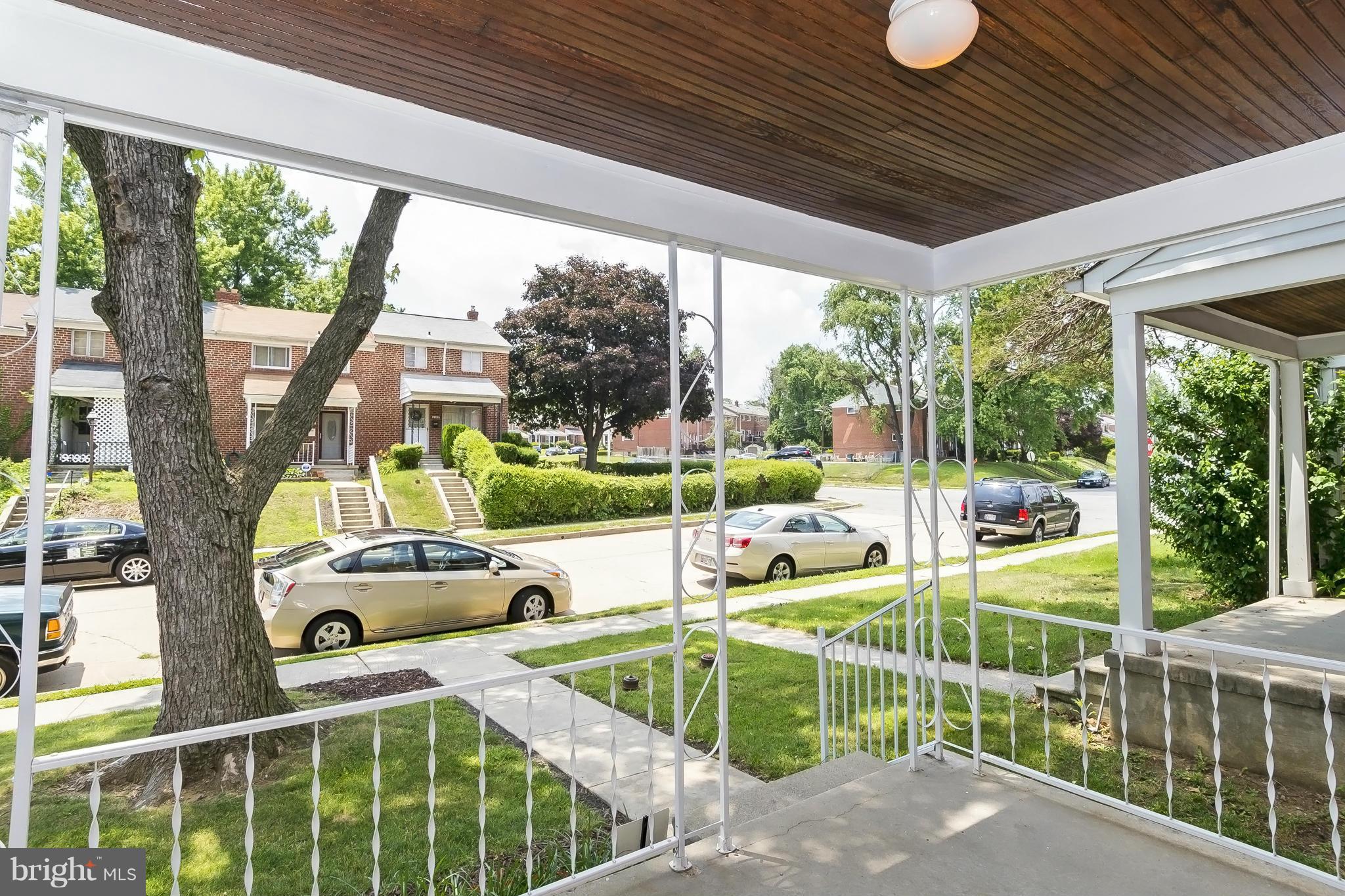 607 Brisbane Road Baltimore, MD 21229 - Photo 3 of 28 a view of a porch with furniture and yard